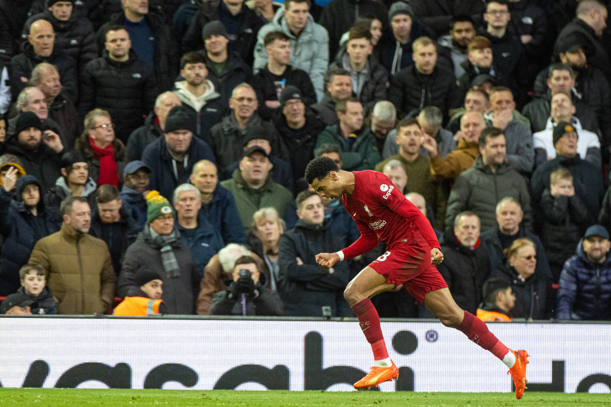 Cody Gakpo pictured celebrating in front of Manchester United fans after scoring for Liverpool at Anfield in March 2023